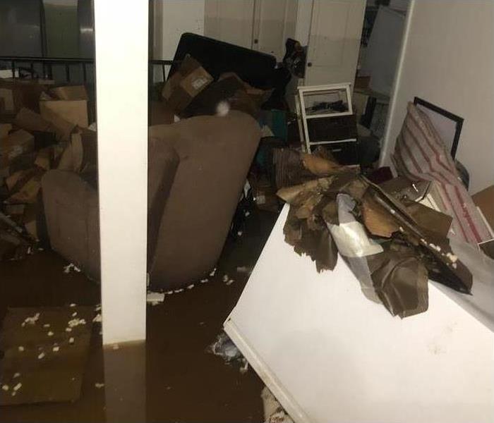dirty floating debris and furnishings in a room