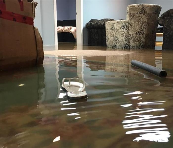 A living room has been flooded with water.